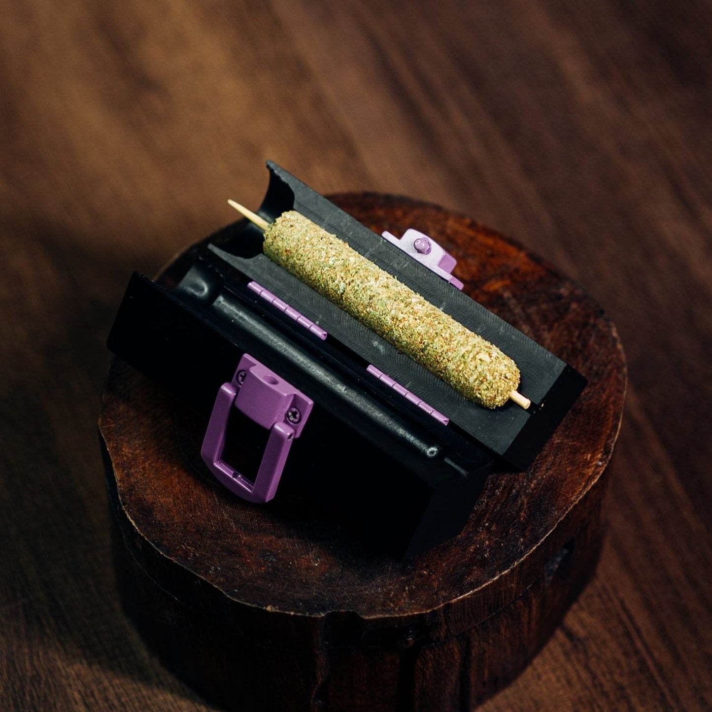 Small cannagar mold displayed with a cured cannagar (cannabis cigar).