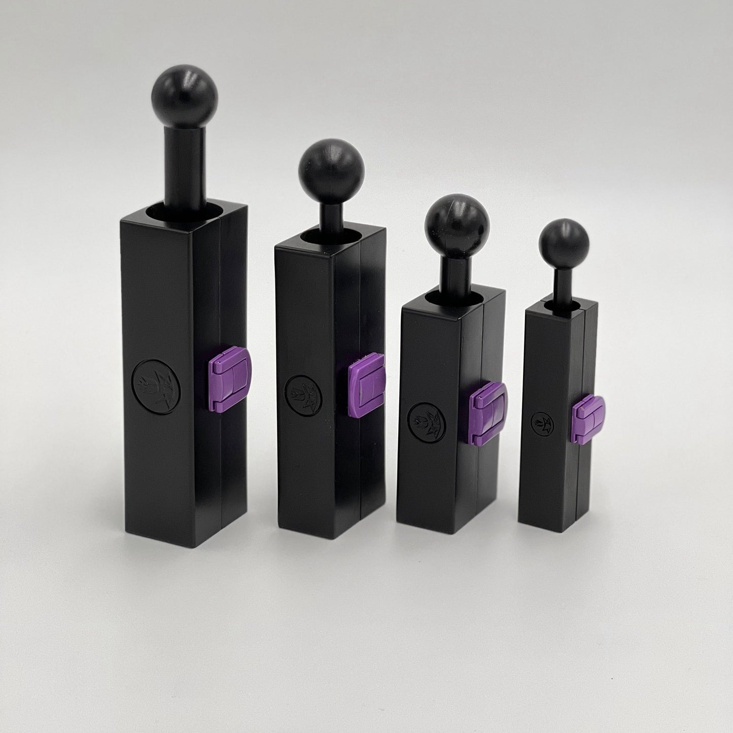 Four different sizes of CannaMolds for making weed cigars. From left to right, the Large, fits 10-14 grams, the Small fits 3.5-7g of flower, the Personal fits 2-4g of weed, and the Mini cannagar mold rolls up 1g.