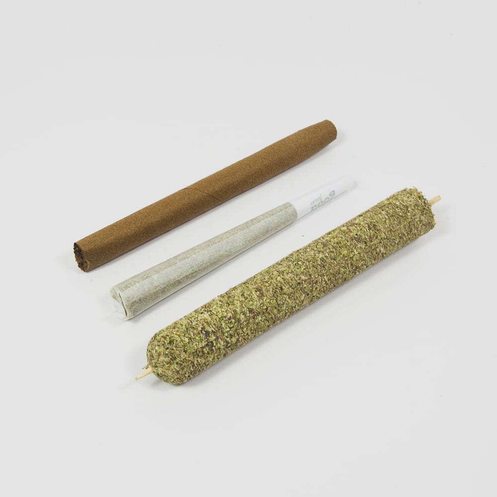 traditional wrapped blunt vs pre-roll joint vs large tobacco-free cannagar, ready for a weed leaf wrap. Comparison shows that a large Purple Rose Supply pressed cannabis cigar is much bigger than a blunt or preroll.