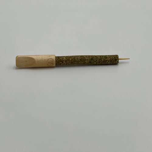 The preroll-sized cannagar displayed with its wood tip for joints and bamboo skewer for inhaling a blunt smoothly